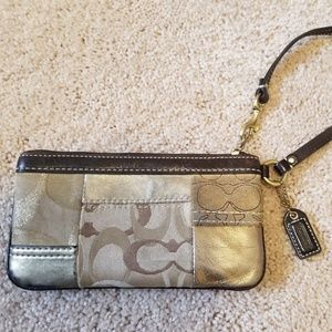 Coach brand Gold, tan and brown wristlet